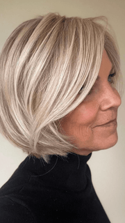 Susan Sparks @sparkles_intheworld wearing STRAIGHT UP WITH A TWIST by RAQUEL WELCH WIGS in color SS19/23 SHADED BISCUIT | Cool Platinum blonde with subtle highlights and medium brown roots