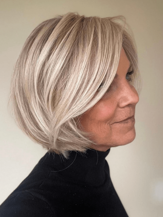 Susan Sparks @sparkles_intheworld wearing STRAIGHT UP WITH A TWIST by RAQUEL WELCH WIGS in color SS19/23 SHADED BISCUIT | Cool Platinum blonde with subtle highlights and medium brown roots