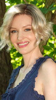 Model wearing DONNA by ENVY in SILKY BEIGE | Light Platinum Blonde with Dark Brown Roots