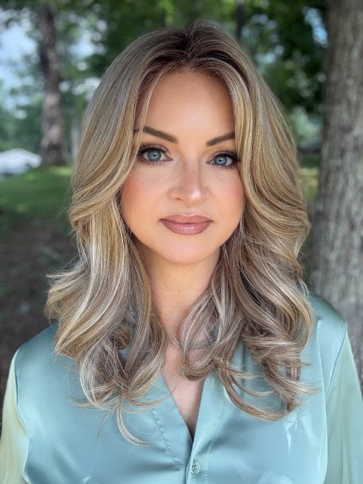 Sandy wearing ROBERTS by BELLETRESS in BUTTERCAKE BLONDE-R | A neutral-warm blonde blend featuring light brown, ash, and lightest blonde tones with natural-looking darker roots for added depth and realism.