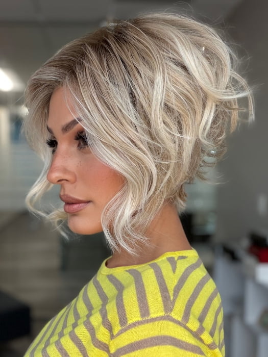 Roxie wearing LOS ANGELES by BELLETRESS in CRUSHED ALMOND BLONDE R | A soft Neutral Light Blonde with a Light and Medium Blended Root Color.