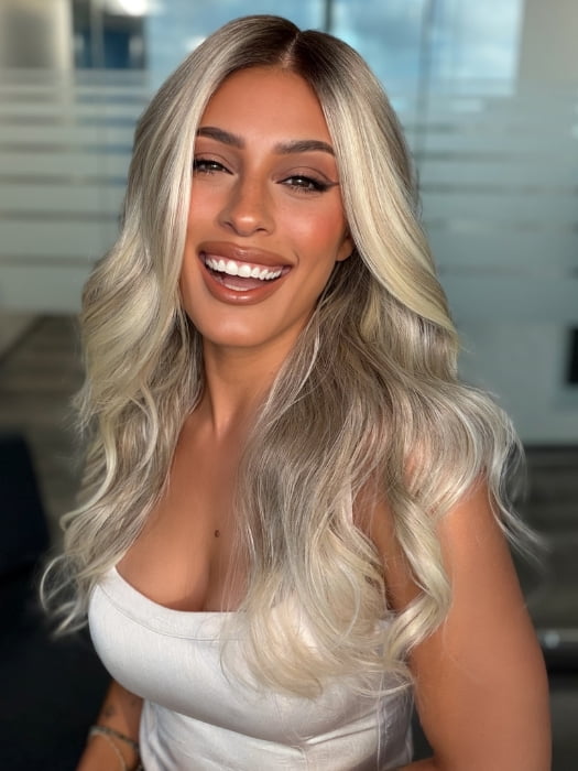 Roxie wearing ESME by RENE OF PARIS in BILLIONAIRE-BLOND | A Rich Mocha Root melting into Beige, Ash, and Cream Blond tones. Face-framing cream and White Blond highlights