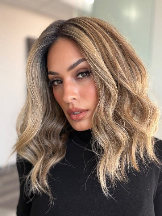 Model is wearing COREY by ENVY in color HONEY BREEZE | A blend of Cool, Honey Blonde and Multi-Dimensional Medium Brown with Darker Brown Roots