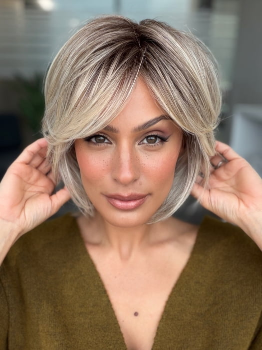 Roxie wearing WINTOUR by BELLETRESS in COOL CHAI BLONDE-R | A balanced cool blonde with softly contrasted darker roots, a fresh twist on classic blonde tones.