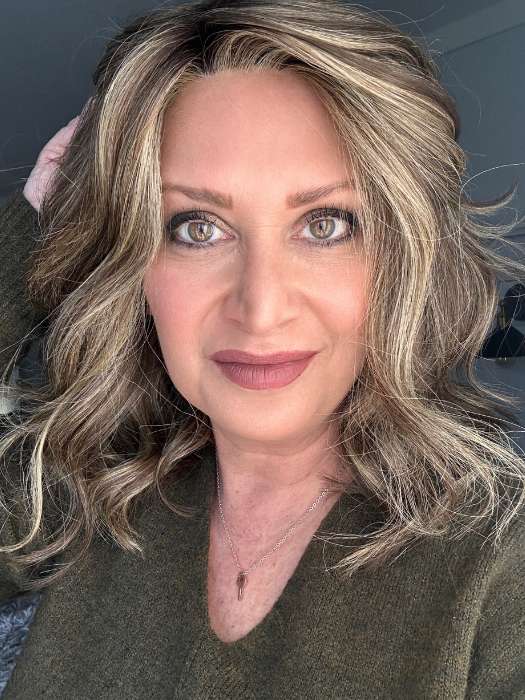 Emily Herrin @she_sheds_more wearing BELLA VIDA by RAQUEL WELCH WIGS in color RL9/24SS SHADED ICED CAFÉ LATTE | Dark Brown shaded with Golden Brown