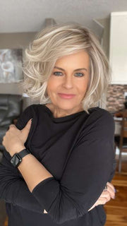Donna @style.me.ageless wearing FLIRT ALERT by RAQUEL WELCH WIGS in color RL19/23SS SHADED BISCUIT | Light Ash Blonde Evenly Blended with Cool Platinum Blonde with Dark Roots