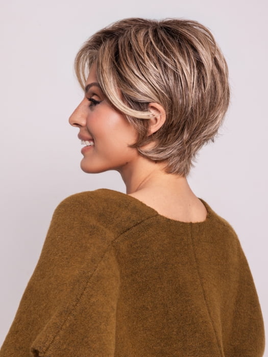 Roxie is wearing POSH PREMIERE by RAQUEL WELCH in RL12/22SS SHADED CAPPUCCINO | Light Golden Brown Evenly Blended with Cool Platinum Blonde Highlights with Dark Roots