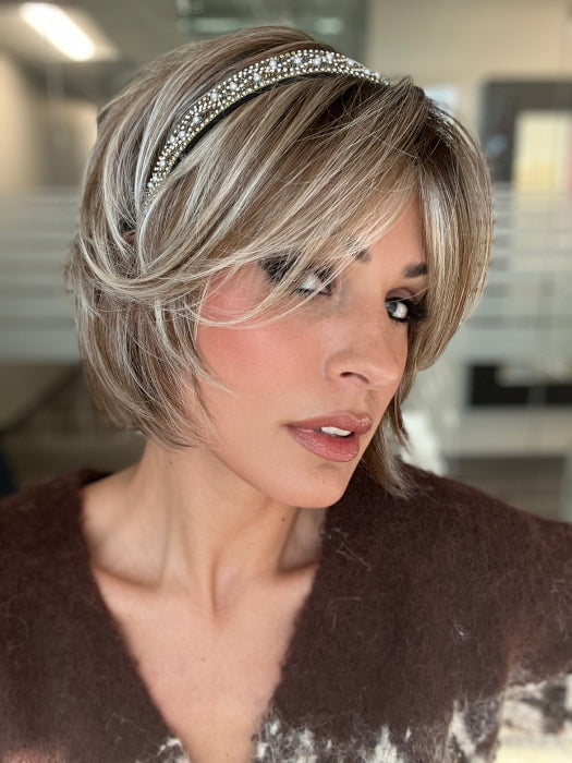 ROXIE wearing ZEAL by NORIKO in MELTED-MARSHMALLOW | Subtly Warm Dark Sandy Blonde Blend with Medium Brown Roots and Light Ash Blonde Tips and Highlights