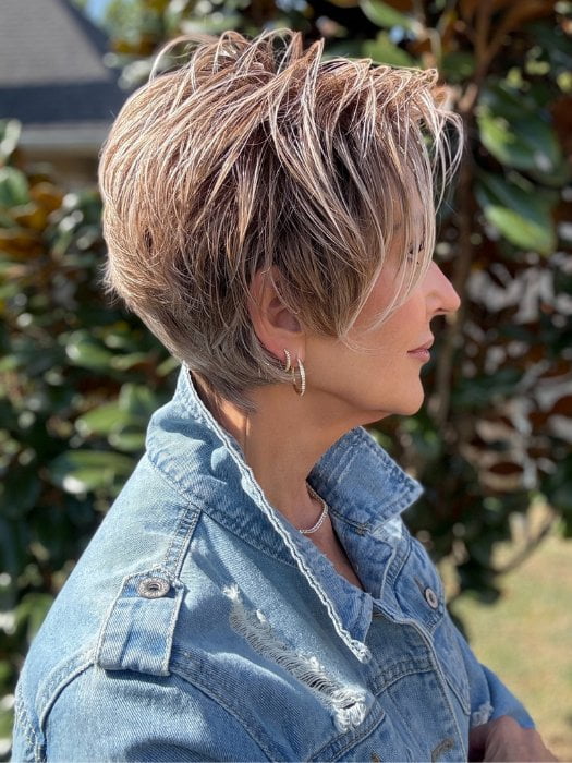 Eileen wearing SPENCER by BELLETRESS in BUTTERCAKE BLONDE-R | A neutral-warm blonde blend featuring light brown, ash, and lightest blonde tones with natural-looking darker roots for added depth and realism.