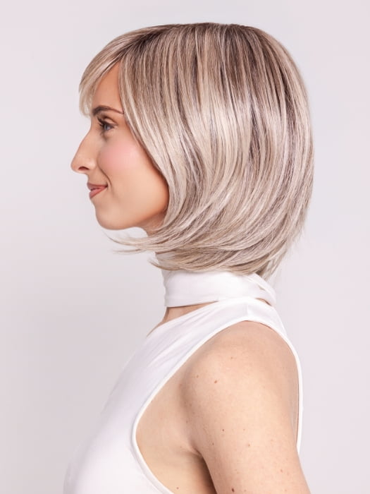 Ava wearing WINTOUR by BELLETRESS in COOL CHAI BLONDE-R | A balanced cool blonde with softly contrasted darker roots, a fresh twist on classic blonde tones.