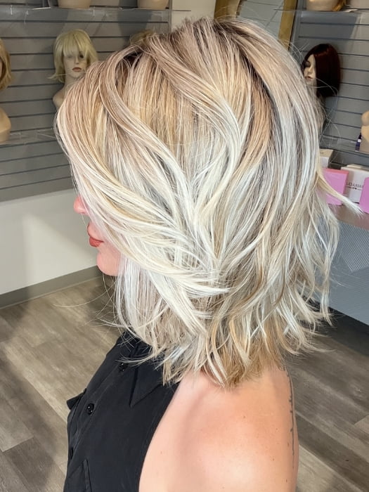 Madeline wearing PARK AVE by BELLETRESS in MILKSHAKE BLONDE R | A mixture of Light Sandy Brown, Highlighted with Light Ash Blonde with a Hint of Light Platinum Blonde with a Medium Root Color