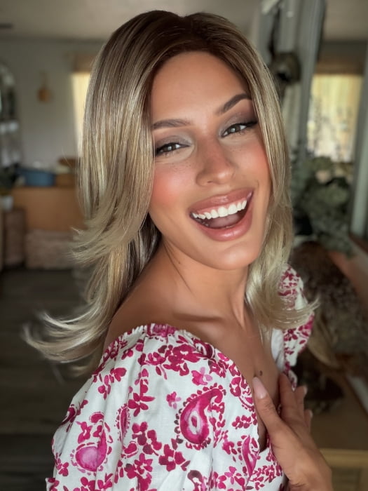 Roxie wearing HARLOW by NORIKO in MELTED-MARSHMALLOW | Subtly Warm Dark Sandy Blonde Blend with Medium Brown Roots and Light Ash Blonde Tips and Highlights
