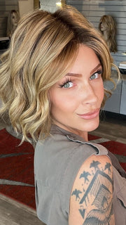 Madeline wearing AUSTEN by BELLETRESS in  CARAMEL TOFFEE BLONDE-R | Toffee is a warm, dimensional shade blending medium brown with golden blonde and caramel highlights. Softly rooted for a natural, sun-kissed finish.