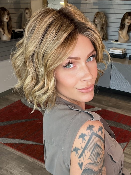 Madeline wearing AUSTEN by BELLETRESS in  CARAMEL TOFFEE BLONDE-R | Toffee is a warm, dimensional shade blending medium brown with golden blonde and caramel highlights. Softly rooted for a natural, sun-kissed finish.