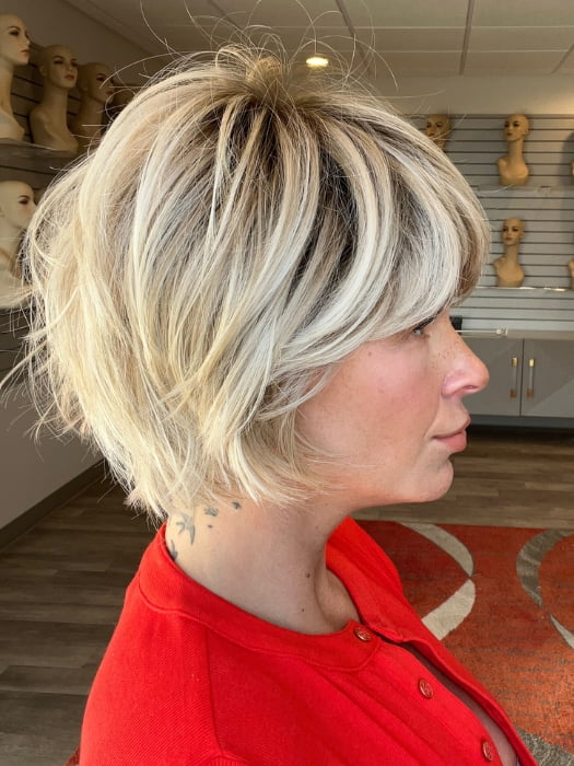 Madeline wearing TOLEDO by BELLETRESS in CRUSHED ALMOND BLONDE R | A soft Neutral Light Blonde with a Light and Medium Blended Root Color.
