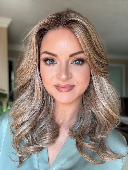Sandy wearing ROBERTS by BELLETRESS in BUTTERCAKE BLONDE-R | A neutral-warm blonde blend featuring light brown, ash, and lightest blonde tones with natural-looking darker roots for added depth and realism.