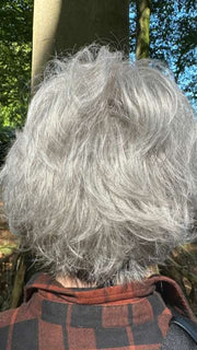Mel B. @mels.be.ageless wearing VOLTAGE PETITE by RAQUEL WELCH WIGS in color RL51/61 ICED GRANITA | Lightest Grey Progresses to a Deep Grey at the Nape