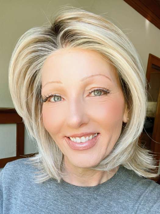 Alicia F. @wigginout wearing BIG TIME by RAQUEL WELCH WIGS in color RL19/23SS SHADED BISCUIT | Light Ash Blonde Evenly Blended with Cool Platinum Blonde with Dark Roots | window lighting