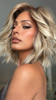 Roxie wearing STEAL THE SHOW by RAQUEL WELCH in SS19/23 SHADED BISCUIT | Cool Platinum Blonde with subtle highlights and Medium Brown roots