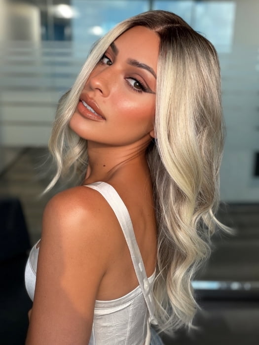 Roxie wearing ESME by RENE OF PARIS in BILLIONAIRE-BLOND | A Rich Mocha Root melting into Beige, Ash, and Cream Blond tones. Face-framing cream and White Blond highlights