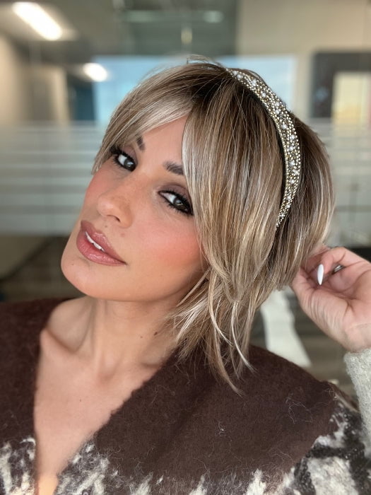 ROXIE wearing ZEAL by NORIKO in MELTED-MARSHMALLOW | Subtly Warm Dark Sandy Blonde Blend with Medium Brown Roots and Light Ash Blonde Tips and Highlights 