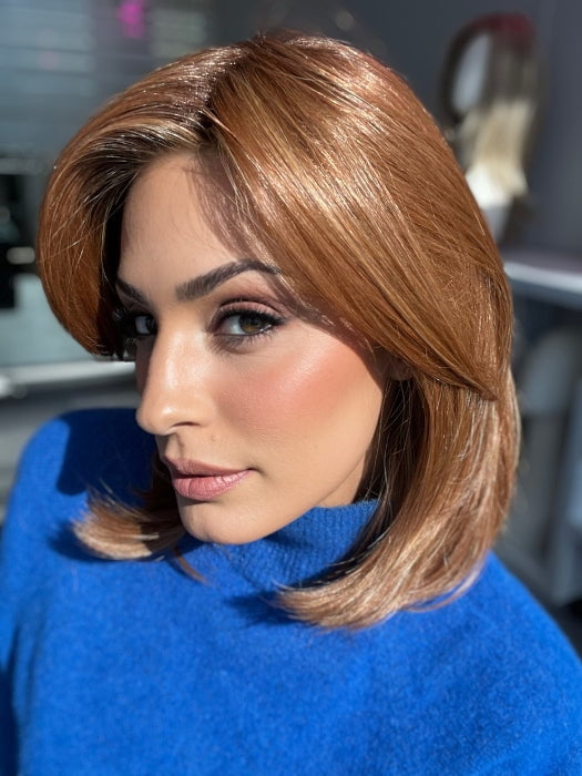 Roxie wearing HUDSON by BELLETRESS in PUMPKIN PIE SPICE-R | Medium brown rooted, combination of strawberry, medium and light copper red, highlighted with light blonde.