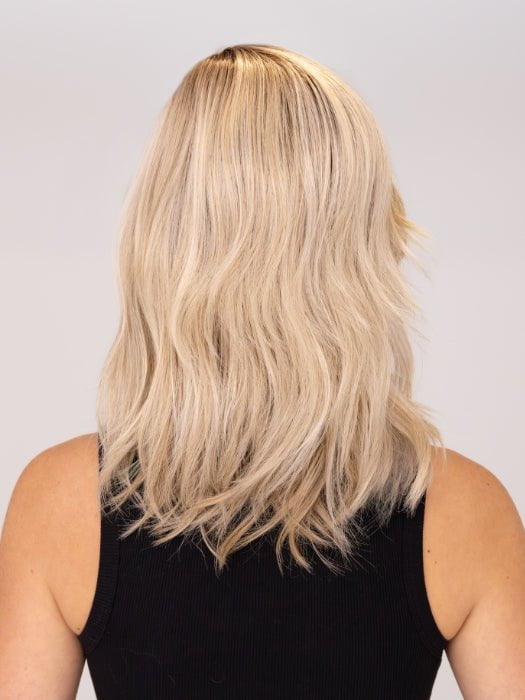 Model is wearing DAZZLING WAVEZ by RENE OF PARIS in color MILKY OPAL R | A Blend of Creamy Blonde and White Blonde Rooted with Warm Brown