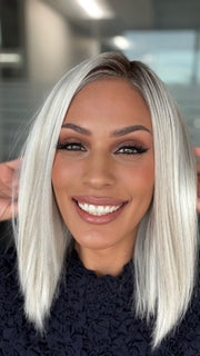 Roxie Wearing SUTTON by ESTETICA in SILVERSUN/RT8 | ICED BLONDE WITH SOFT SAND & GOLDEN BROWN ROOTS
