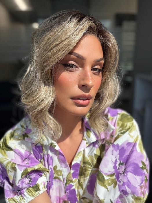Roxie is wearing VERONICA by BELLETRESS in SPARKLING CHAMPAGNE BLONDE R | A radiant blend of champagne blonde with soft golden and beige tones, grounded by natural-looking roots in ash brown and dark blonde.