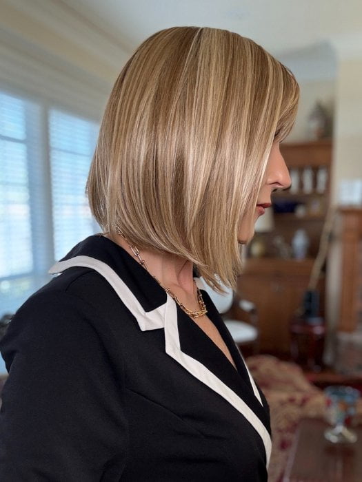 Eileen wearing PAIGE PETITE by ENVY in SPARKLING CHAMPAGNE | Medium Brown roots with overall Strawberry Blonde base and soft Golden Blonde highlights