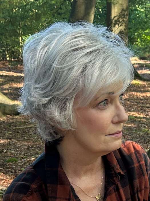 Mel B. @mels.be.ageless wearing VOLTAGE LARGE by RAQUEL WELCH WIGS in color RL51/61 ICED GRANITA | Lightest Grey Progresses to a Deep Grey at the Nape