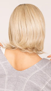 Roxie wearing TAKE A BOW by RAQUEL WELCH in RL19/23SS SHADED BISCUIT | Light Ash Blonde Evenly Blended with Cool Platinum Blonde with Dark Roots