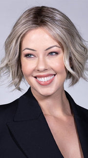 Model is wearing AUSTEN BY BELLETRESS in color COOL CHAI BLONDE-R 10/17/23+8 | A balanced cool blonde with softly contrasted darker roots, a fresh twist on classic blonde tones.