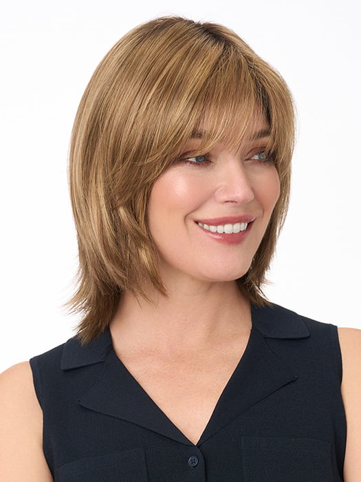 Model is wearing AMBER by ENVY in color TOASTED SESAME | Medium Brown roots with overall Warm Cinnamon base and Wheat Blonde highlights