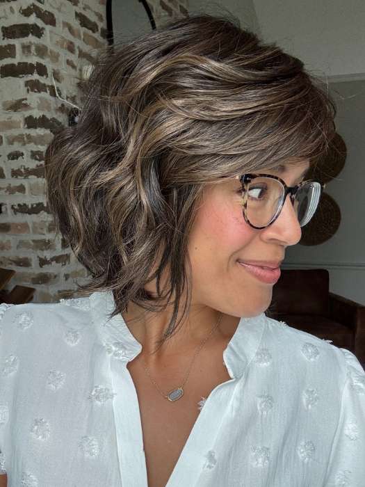 Brea @getwiggywithbrea wearing WAVES AND RAVES by RAQUEL WELCH in color RL4/10SS ICED JAVA | Off Black shaded with Dark Brown