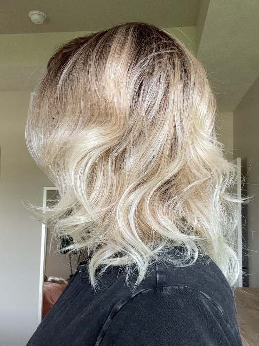 Carlyn @carlynwilson84 wearing ROHAN by AMORE in color MELTED SAND | MELTED SAND | Rich, warm brown root melts into the neutral blond tone. Light-beige blond ends complete this stunning color.