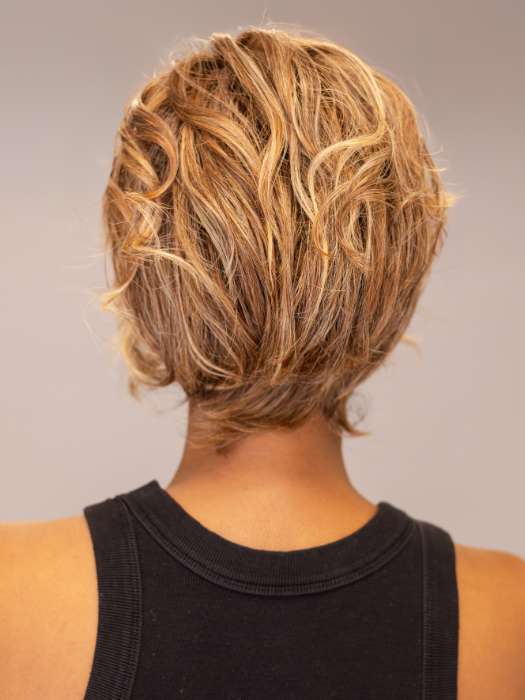 Model is wearing Twisted Pixie by TressAllure in shade EL17/23/R8 | Pale Auburn Beige Blonde Blend, Rooted Medium Brown, Highlighted Light Blonde with face framing highlights