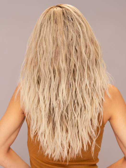 Model is wearing ROXIE by RENE OF PARIS in shade BILLIONAIRE-BLOND | A chic, sophisticated shade with a rich mocha root melting into beige, ash, and cream blond tones. Face-framing cream and white blond highlights add a refined, upscale finish.