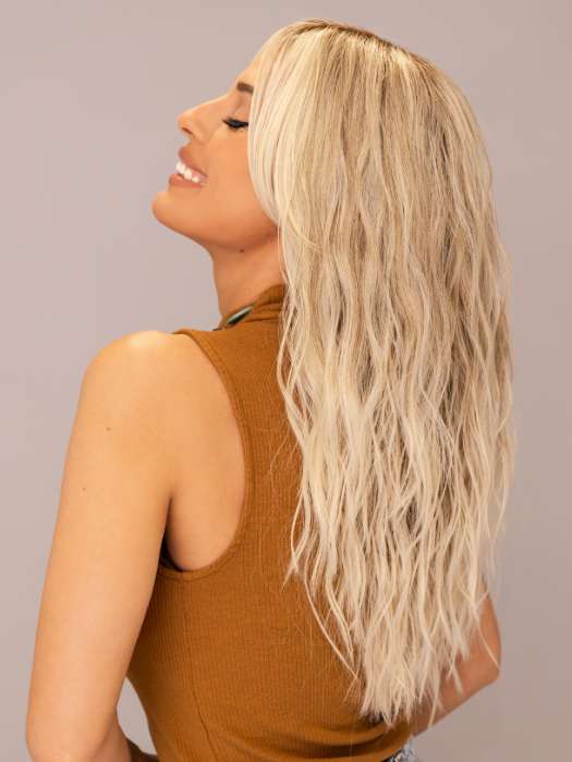 Model is wearing ROXIE by RENE OF PARIS in shade BILLIONAIRE-BLOND | A chic, sophisticated shade with a rich mocha root melting into beige, ash, and cream blond tones. Face-framing cream and white blond highlights add a refined, upscale finish.