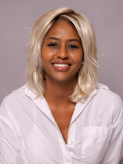 Model is wearing MELLOW by ESTETICA in shade SPF BLONDE | Golden Blonde, Pale Blonde, Iced Blonde Blended with Soft Brown Roots
