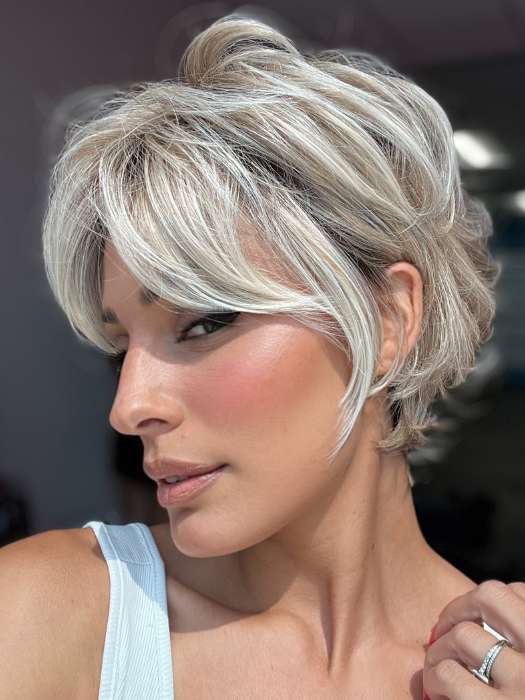 Model is wearing CURATED CUT by RAQUEL WELCH in color RL19/23SS SHADED BISCUIT | Light Ash Blonde Evenly Blended with Cool Platinum Blonde with Dark Roots