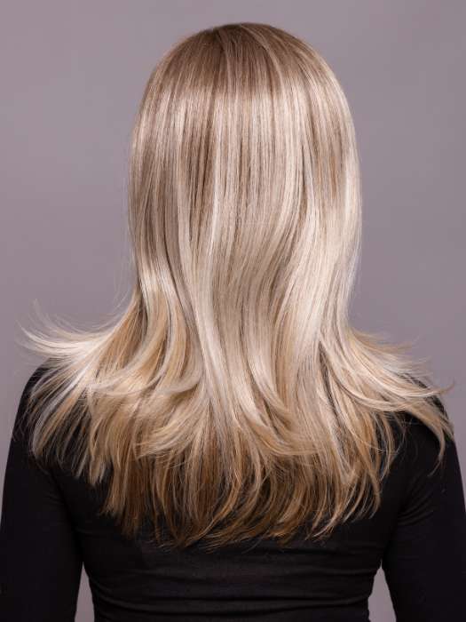 Model is wearing SAVELLI by ELLEN WILLE in color IVORY BLONDE TIPPED 101.15.12 | Dark Neutral Blonde with Pearl Platinum and Pearl White Blend with Lighter Tipped Ends