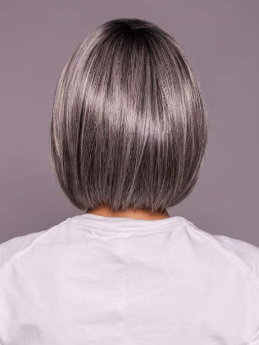 Model is wearing DUA by ELLEN WILLE in color DARK GREY FROSTED | A sophisticated, cool-toned grey with highlights that give your hair an icy, chic vibe.
