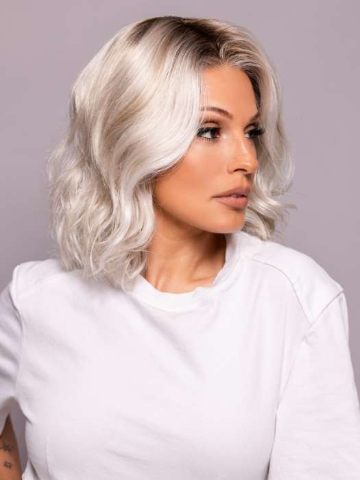 Model is wearing MILA by ELLEN WILLE in shade ICE BLONDE LIGHTED 60.1001.101 | Pearl White, Winter White, and Pearl Platinum Blend with Highlights throughout and Concentrated in the front
