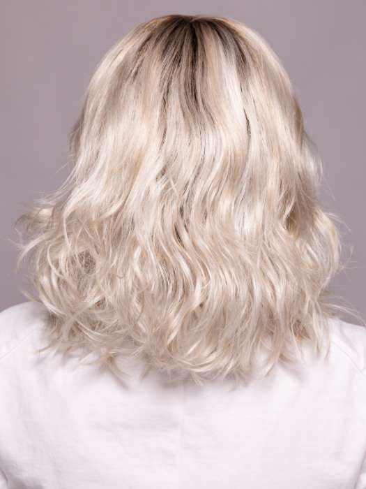 Model is wearing MILA by ELLEN WILLE in shade ICE BLONDE LIGHTED 60.1001.101 | Pearl White, Winter White, and Pearl Platinum Blend with Highlights throughout and Concentrated in the front