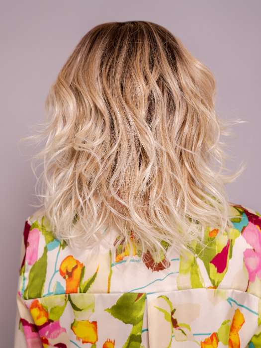 Model is wearing ROHAN by AMORE in color MELTED SAND | Rich, warm brown root melts into the neutral blond tone. Light-beige blond ends complete this stunning color.   