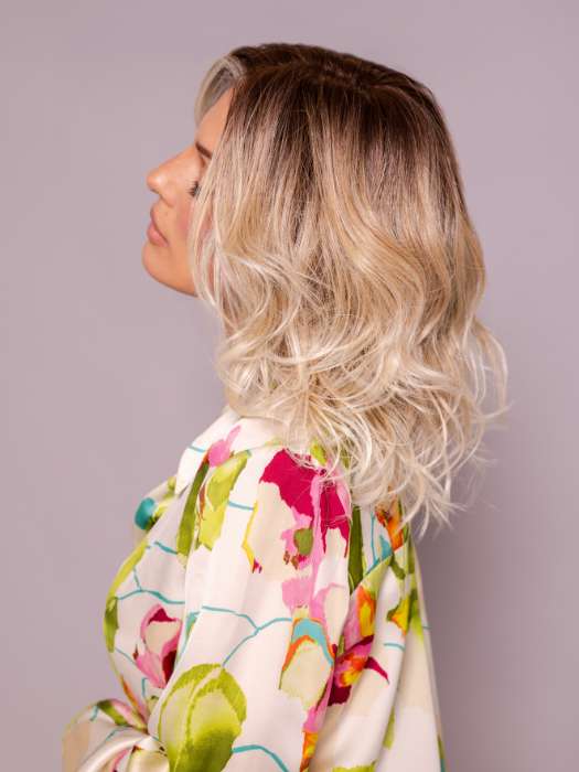Model is wearing ROHAN by AMORE in color MELTED SAND | Rich, warm brown root melts into the neutral blond tone. Light-beige blond ends complete this stunning color.   
