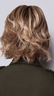 Model is wearing BRANN in SANDY BEIGE BLONDE R | Carefully placed shades of dark sandy blonde and light neutral blonde with medium root tone for added depth.         