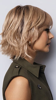 Model is wearing BRANN in SANDY BEIGE BLONDE R | Carefully placed shades of dark sandy blonde and light neutral blonde with medium root tone for added depth.         