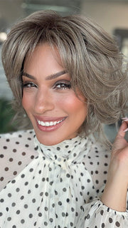 Model is wearing BRANN in color GREIGE-R | A perfect blend of silver-grey and beige tones with medium brown root